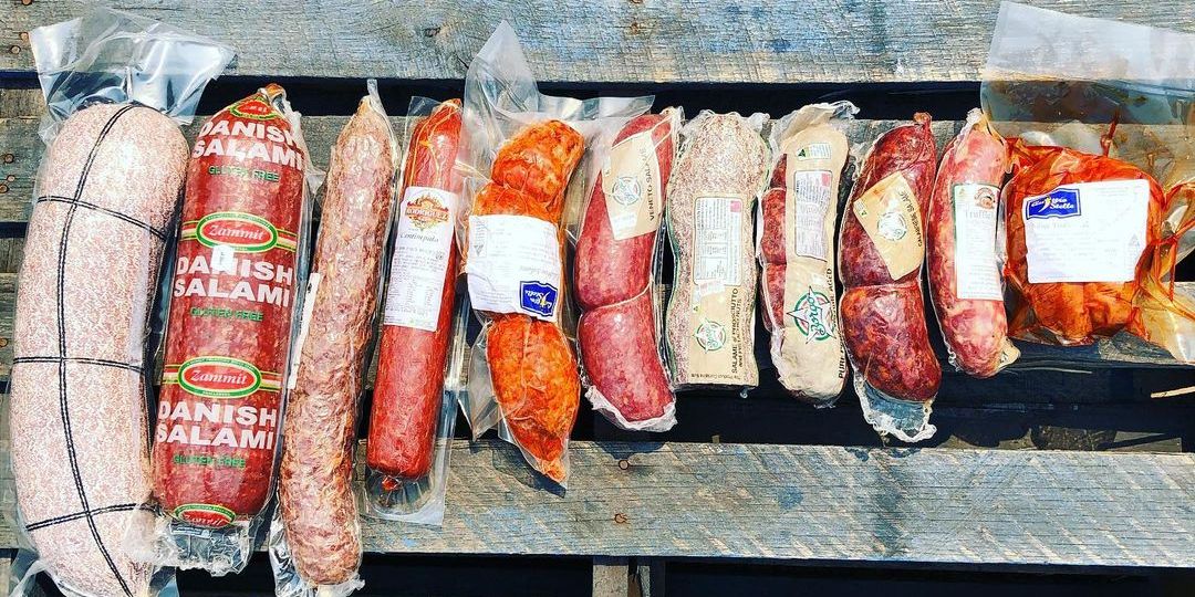 Delicatessen and smallgoods supplies laid out on deli bench