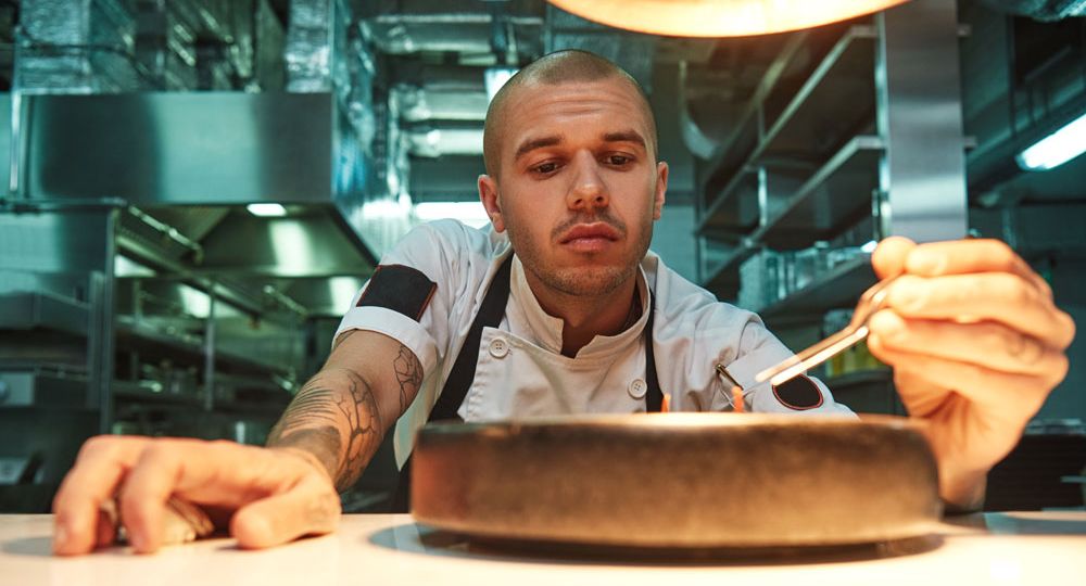 Young chef planning a menu